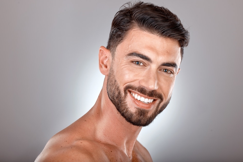 Beauty,,Skincare,And,Portrait,Of,Man,With,Smile,On,Gray Secret™ RF Microneedling in Sugar Land, TX